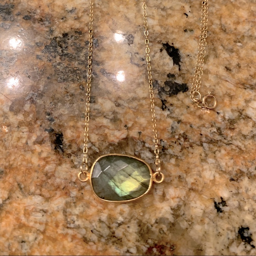 Labradorite pendant on gold tone chain.